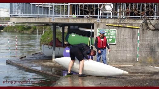 Tobias tipping out the water from the canoe after the afternoon's ride.